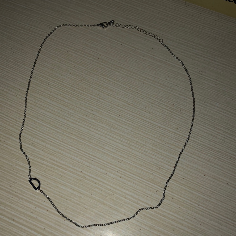 Silver tone “D” necklace
